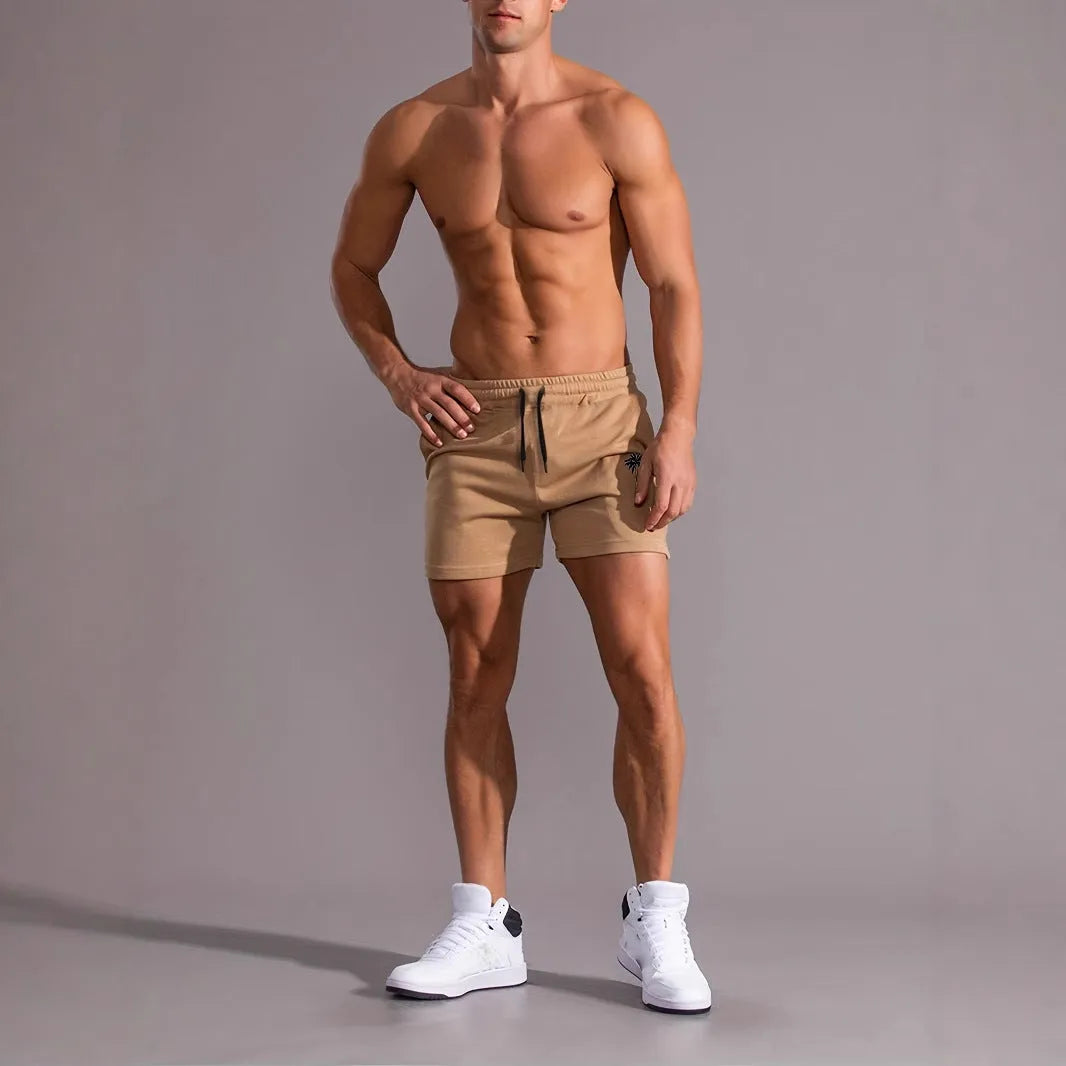 Men's khaki coconut print sports shorts with straight cut design and micro elastic fabric