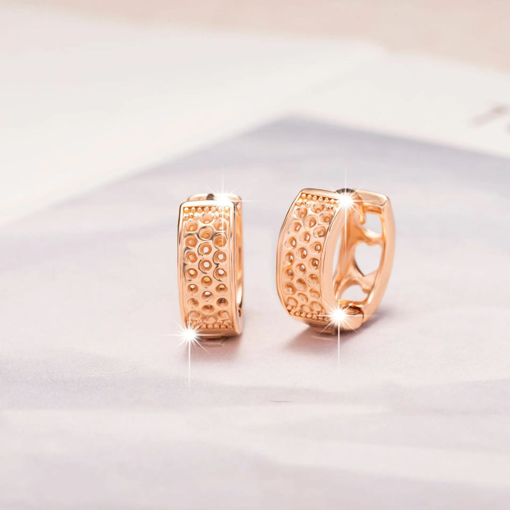 Rose gold hollowed heart shaped women's earrings with electroplated finish