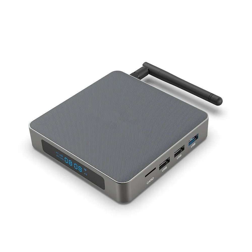 Black Android TV set-top box with remote control on a white background