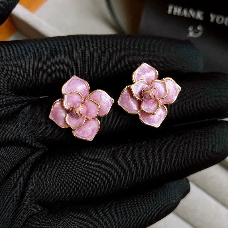 Gold plated copper flower stud earrings with oil-spot glaze in golden-purple colour