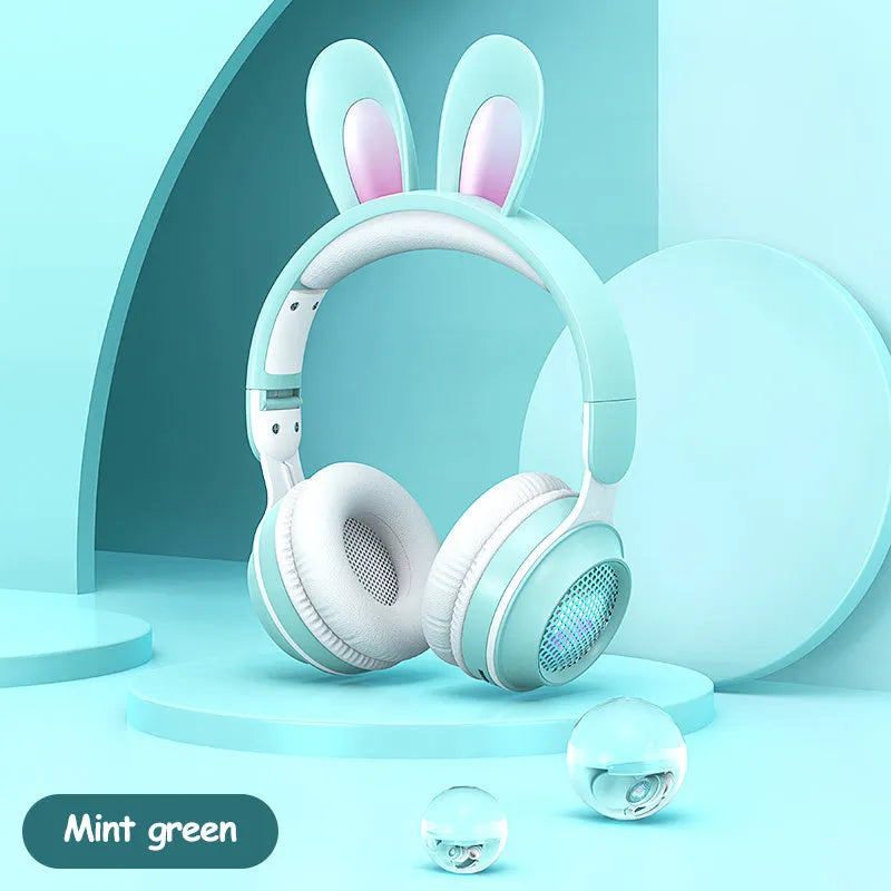 Wireless rabbit ear headphones with RGB LED ears in pink, foldable design on white background