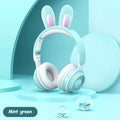 Wireless rabbit ear headphones with RGB LED ears in pink, foldable design on white background