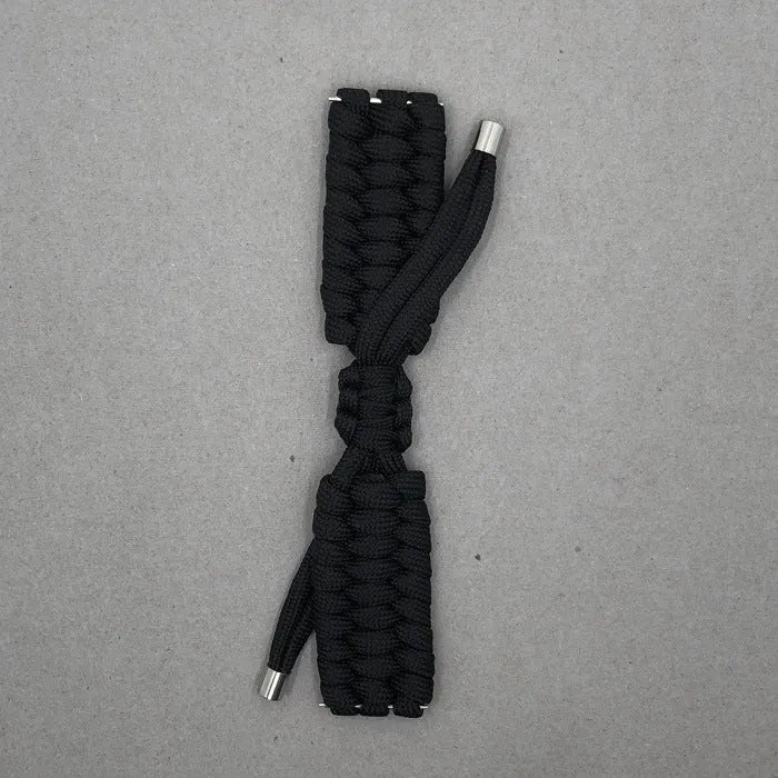 Paracord braided smart watch strap in black on a watch, showing woven texture and metal connectors.