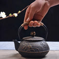 Japanese style cast iron teapot with 0.9 litre capacity shown in a bronze finish.