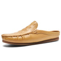 Men's black breathable Gommino semi-slippers with artificial PU upper and rubber sole on a white background