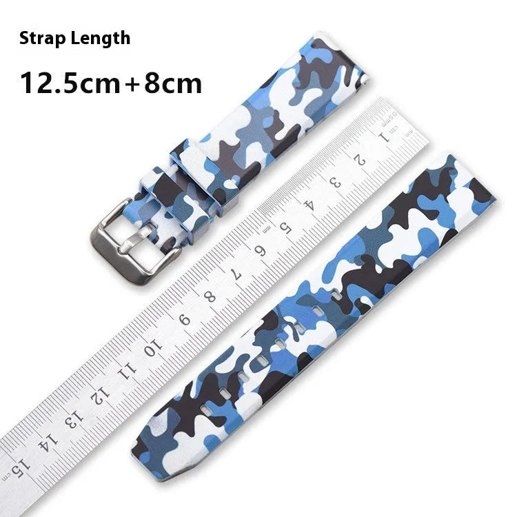 Green camouflage silicone watch strap with flat lugs, shown alongside blue and grey versions.