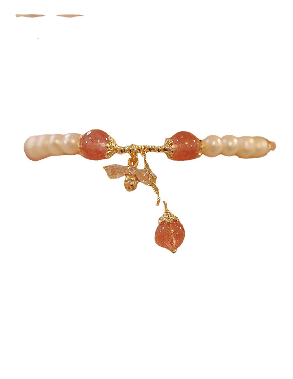 Close-up of a women's hand-strung strawberry quartz crystal bracelet with a decorative bow.