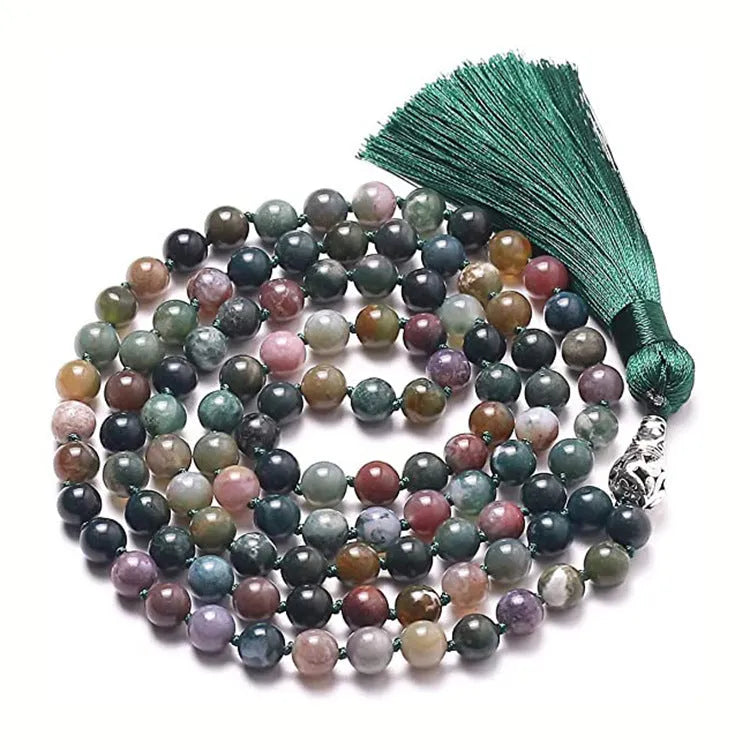 Long multicoloured agate tassel necklace with geometric beads and a flowing pendant.