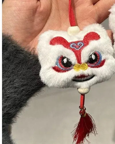 Chinese style blue and yellow plush lion keychain ornament with star stone decoration and cartoon styling