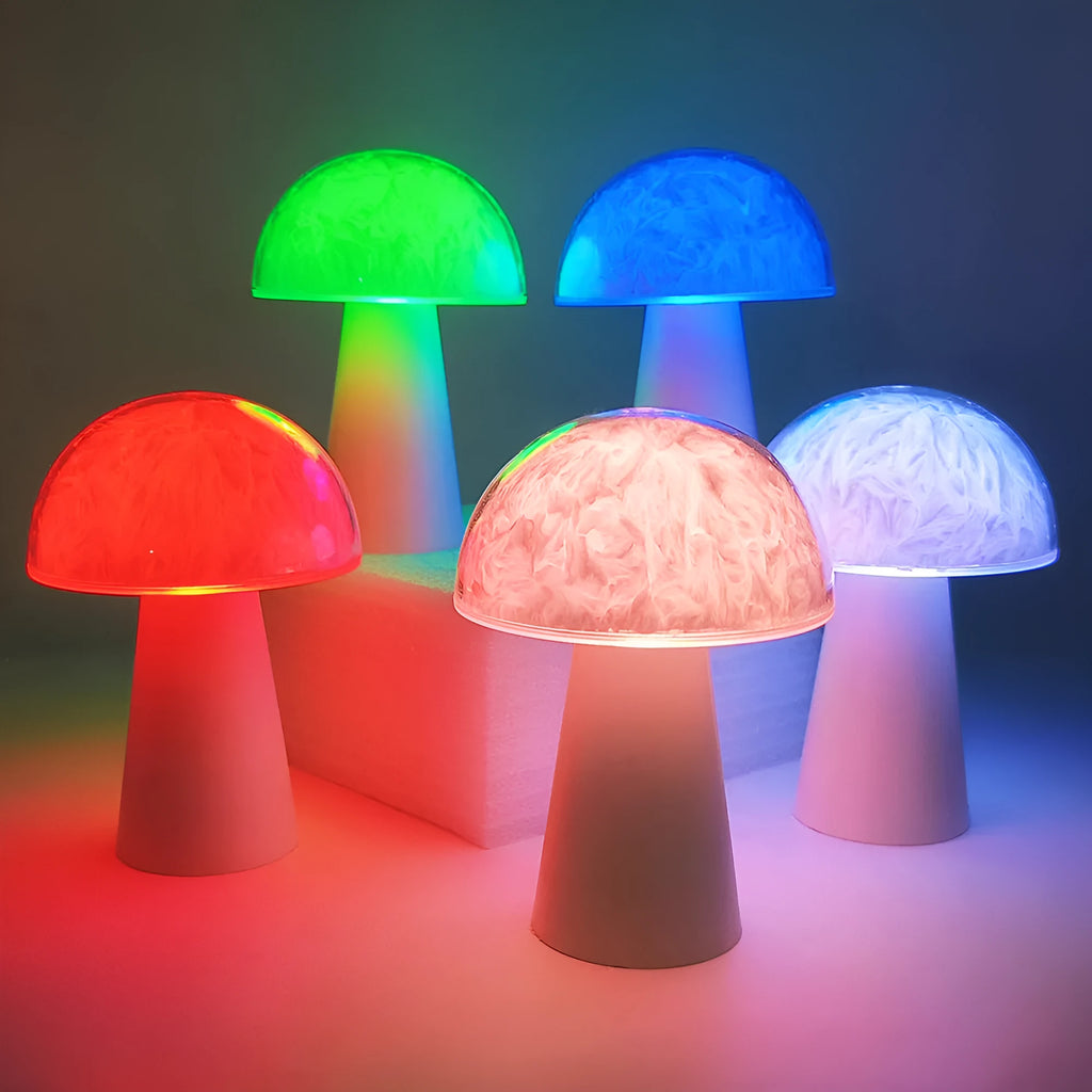 Small white mushroom-shaped night light with colourful RGB glow on a wooden table.