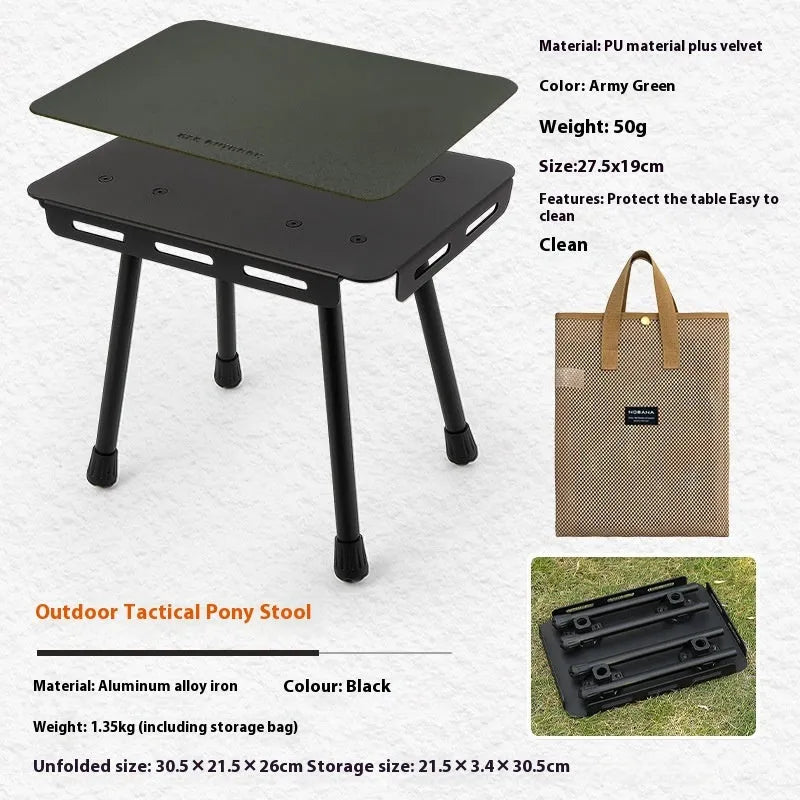 CLS aluminium folding camping stool shown in army green, converted into a small raised table next to a storage bag.