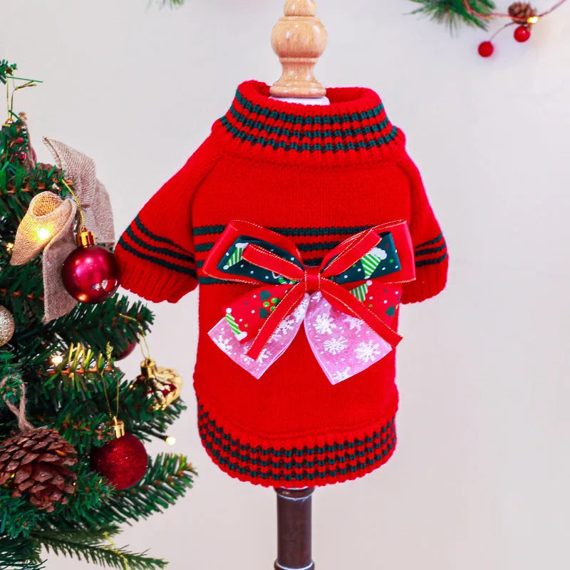Red and green Merry Christmas design dog jumper on a small pet, showing the festive pattern and knit construction.