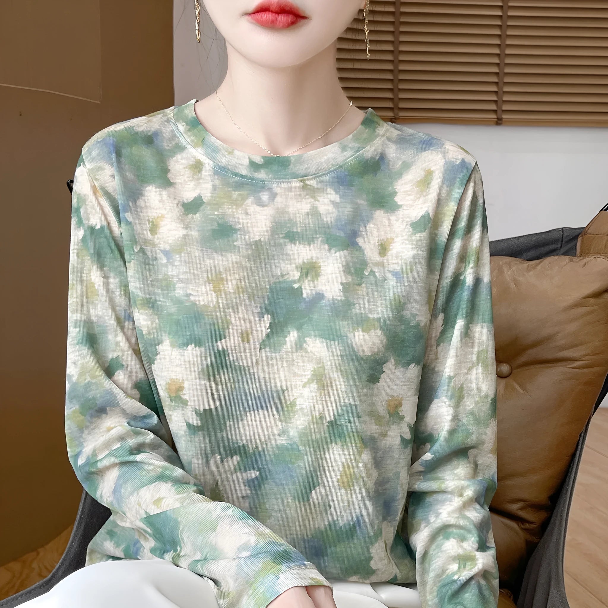 Women's round neck knit pullover shirt with artistic floral print in Tencel cotton fabric.