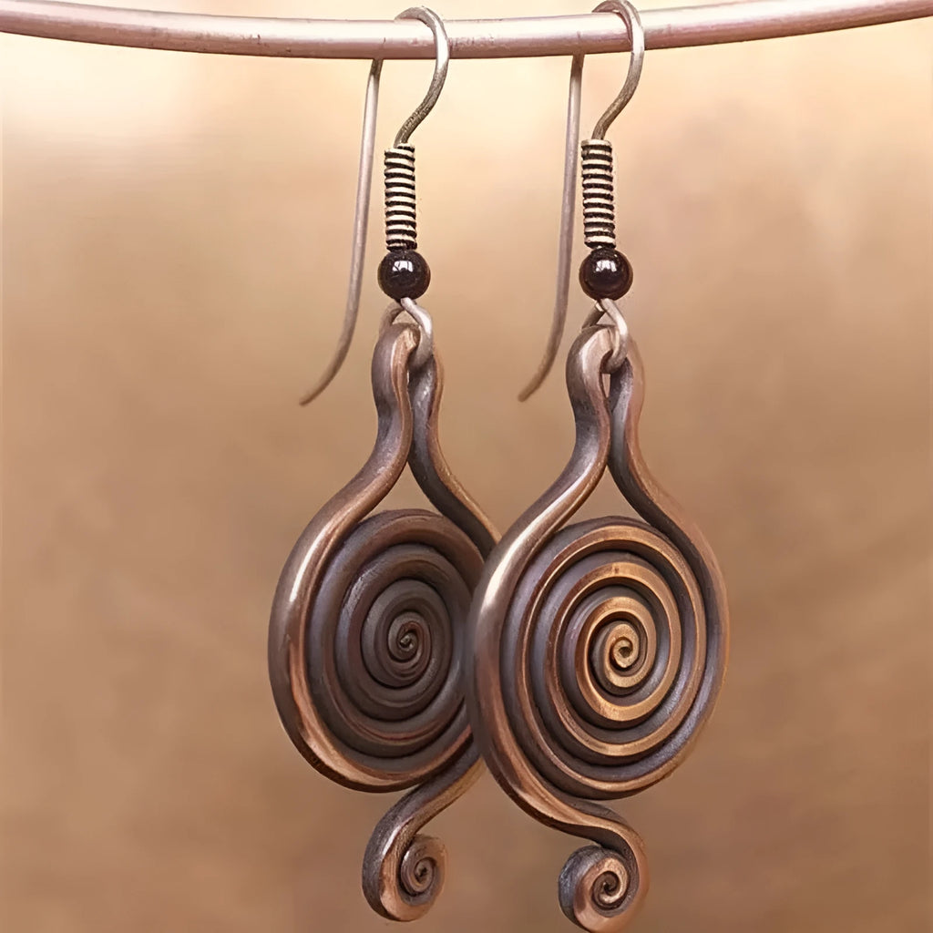 Bronze spiral psychedelic drop earrings with geometric shape and alloy construction