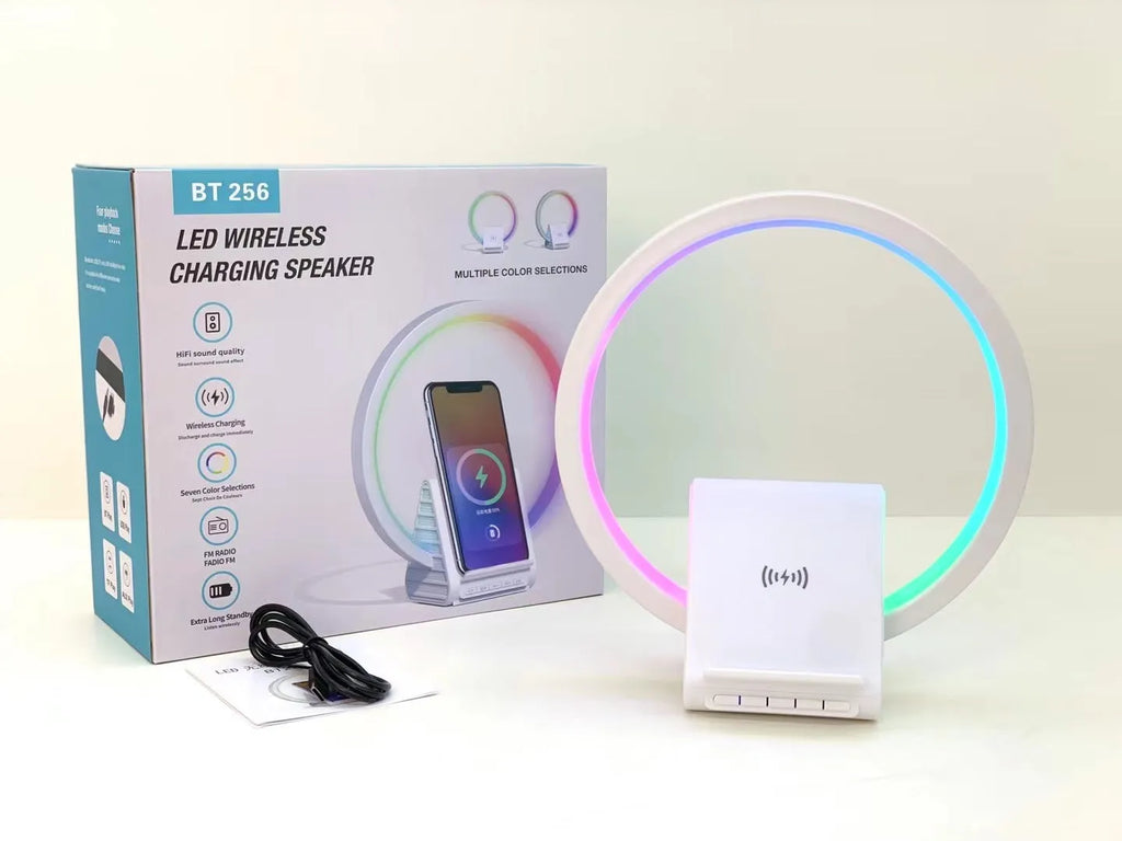 White rectangular Bluetooth speaker with wireless charging surface and ambient lighting