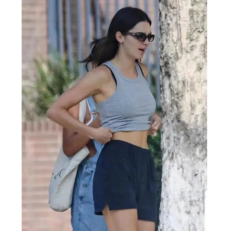 Women's dark blue cotton high-top sports shorts with white flag embroidery, shown in a free size fit.
