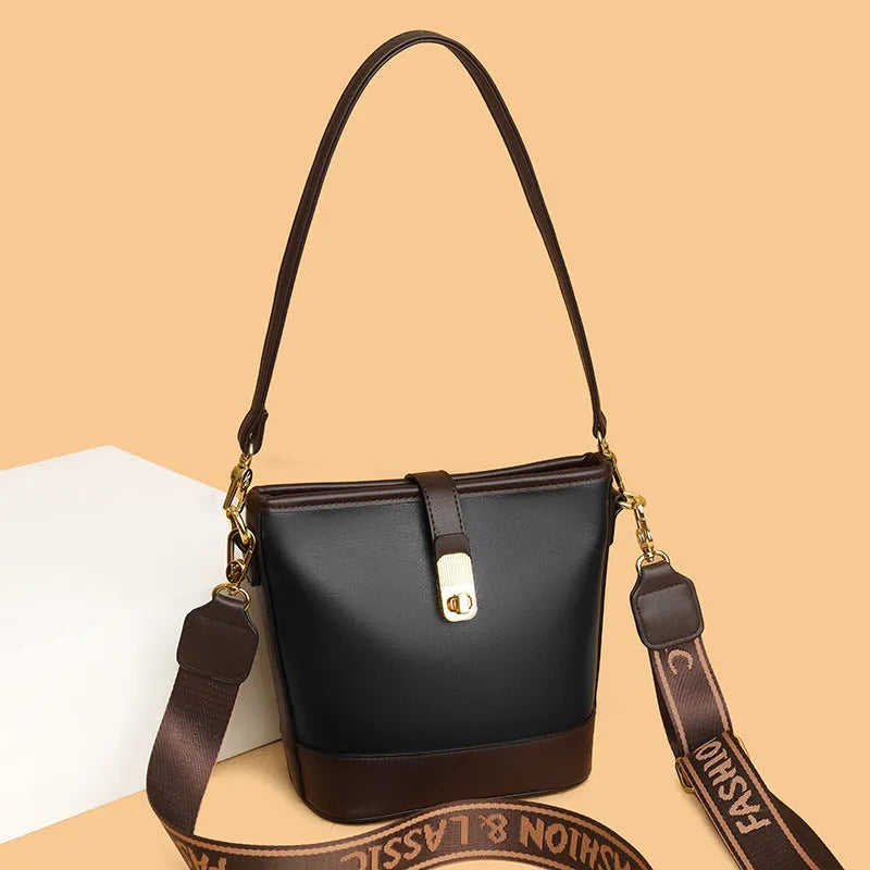 Korean-style black bucket messenger bag showing zipper compartments and adjustable shoulder straps