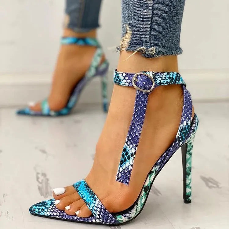 Blue serpentine strap high heels with buckle closure and pointed toe
