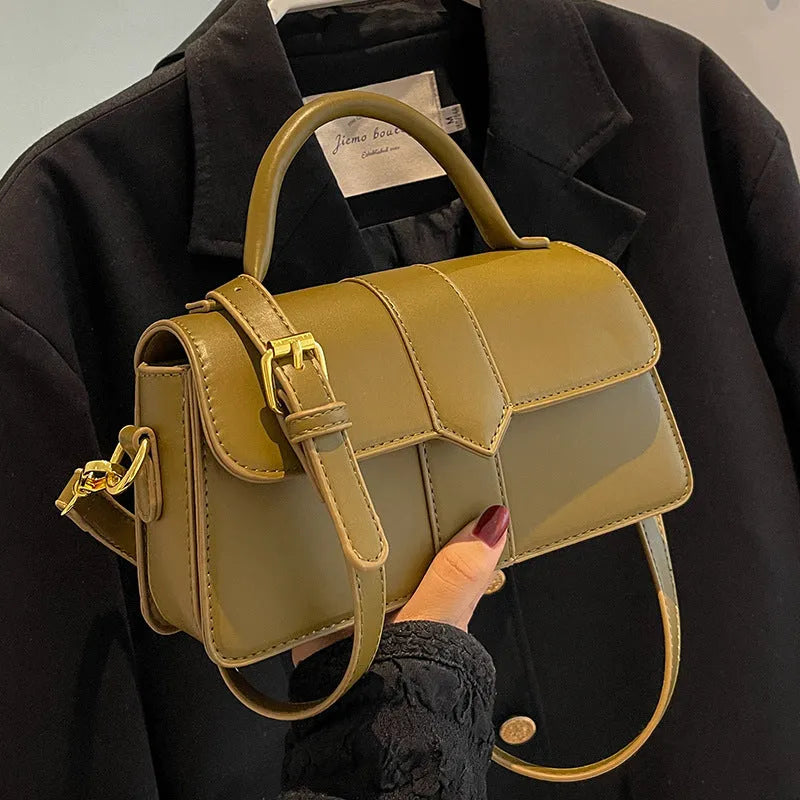 Women's beige messenger bag with adjustable strap showing internal file compartment and outer sandwich pocket