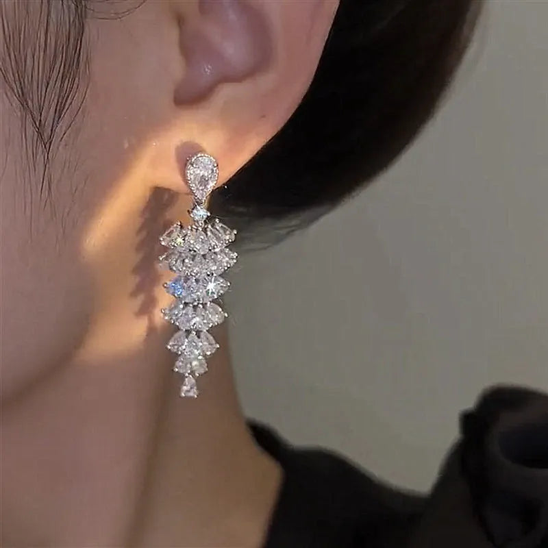 Zircon Christmas tree drop earrings with silver pagoda colour finish on copper construction