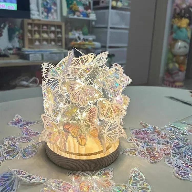 Butterfly shaped night lamp with glass shade on raw wood base measuring 12x15cm