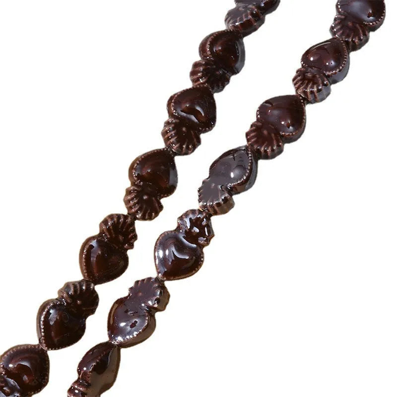 Ceramic love heart torch beads in multiple colours showing 10x15mm size and straight hole design