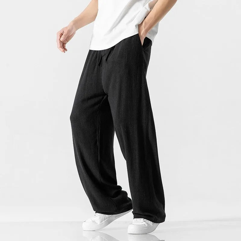 Men's light beige bamboo fibre straight-leg trousers with cropped length and drawstring waist on hanger