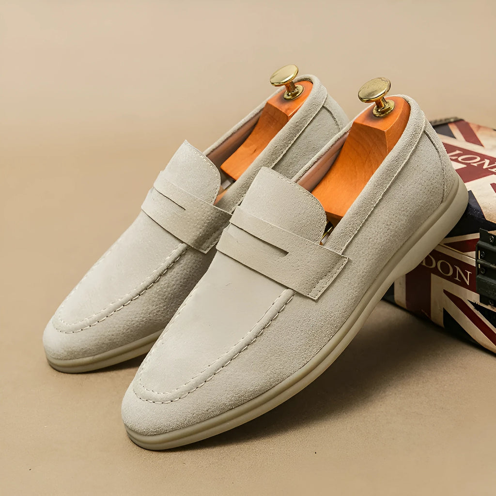 Men's beige leather slip-on casual shoes with a round toe and rubber sole on a white background