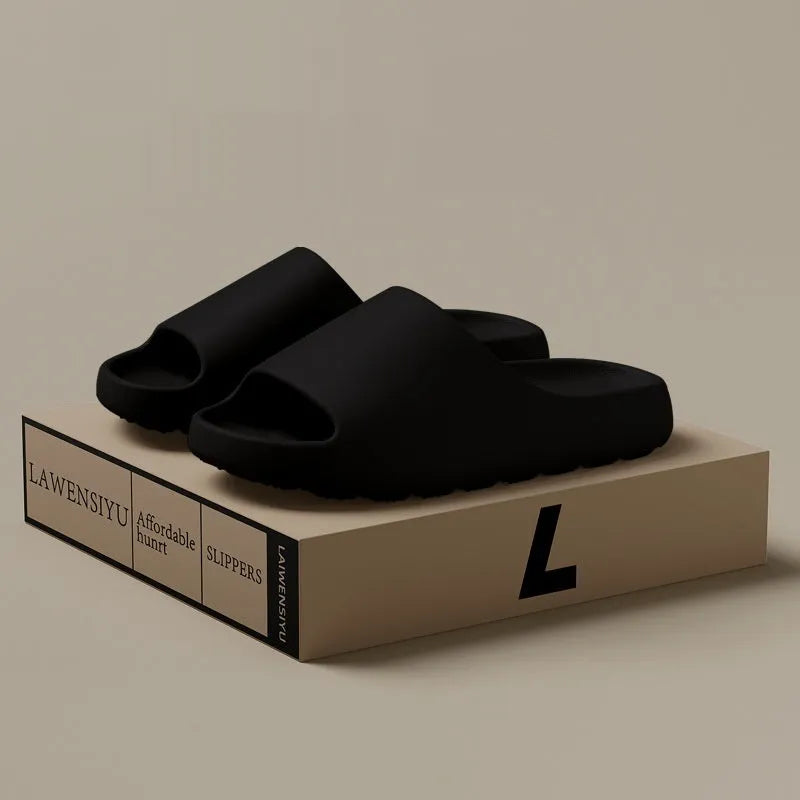 A pair of women's thick-sole beach slippers in a choice of colours, shown on a sandy background.