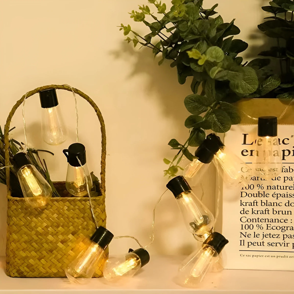 10 metre long retro infusion bottle shaped solar string lights draped outdoors with IP55 waterproof rating.