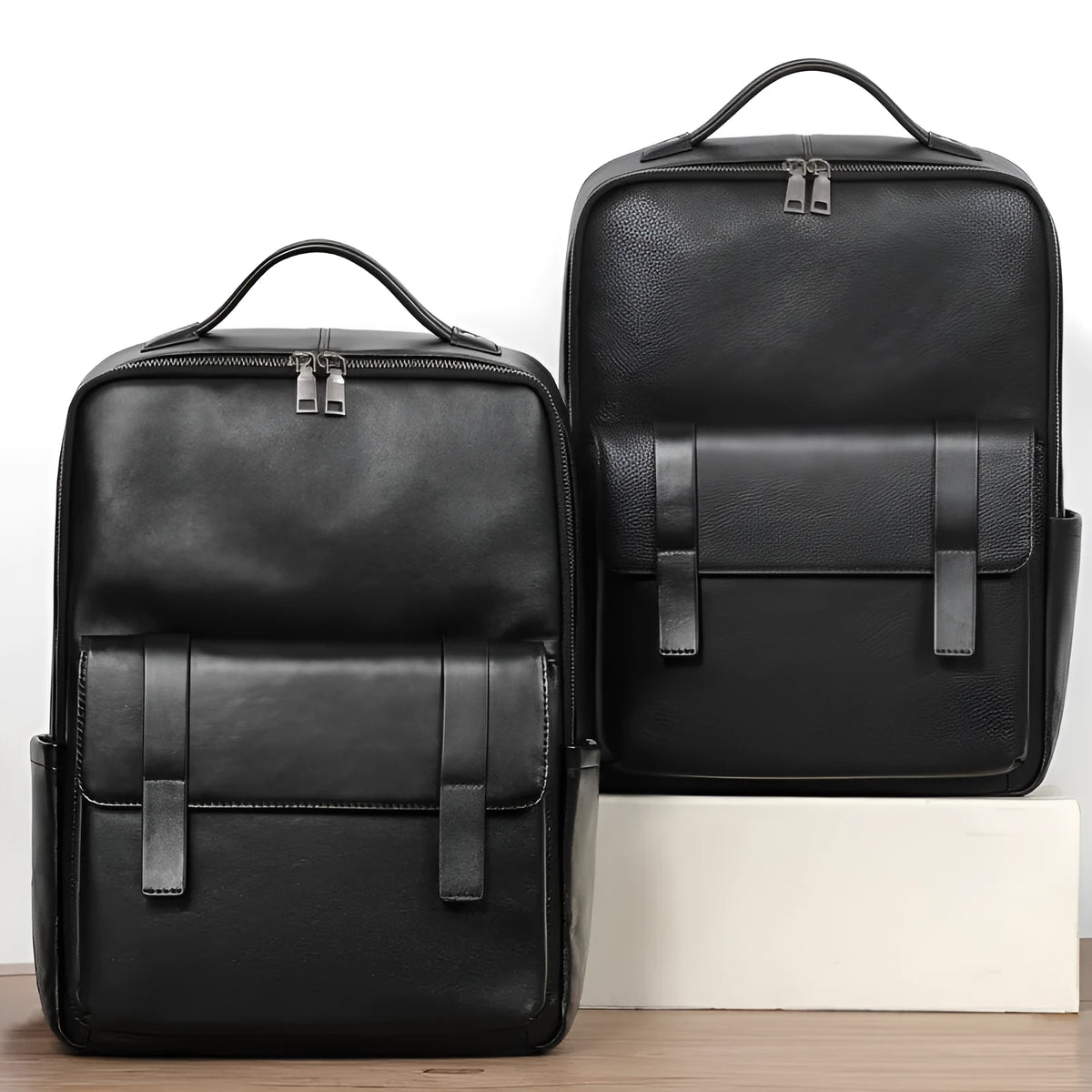 Large black leather men's computer backpack with weaving detail and a physiological curve back.