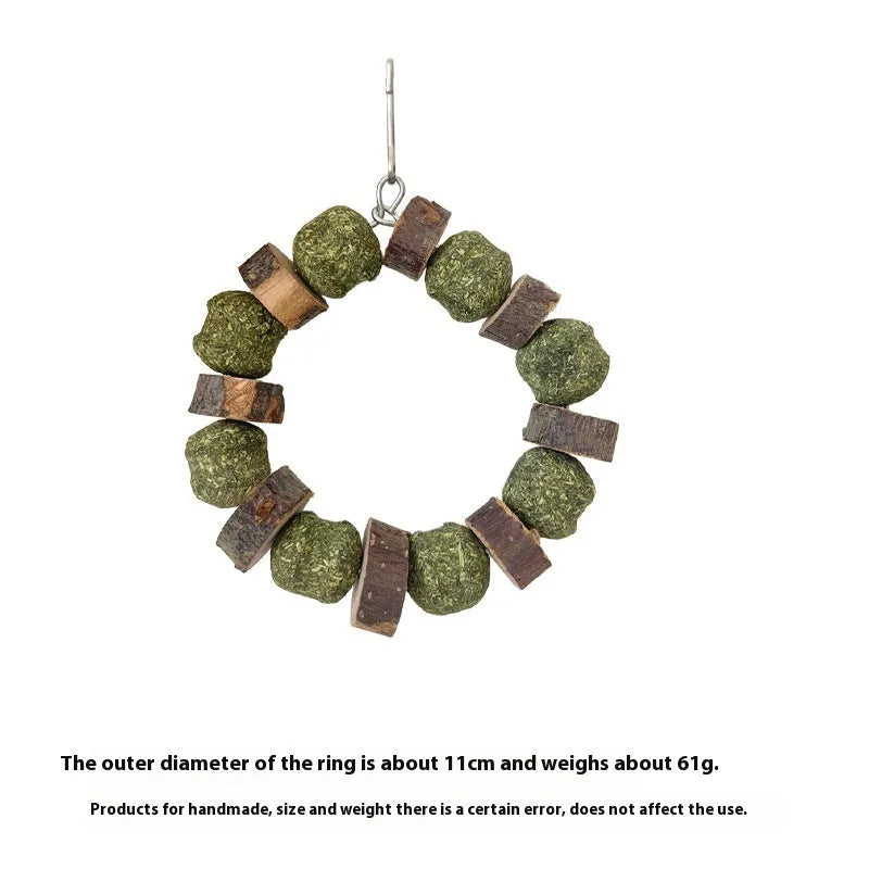 Hamster chew toy featuring an applewood rod with an attached woven straw ball ring.