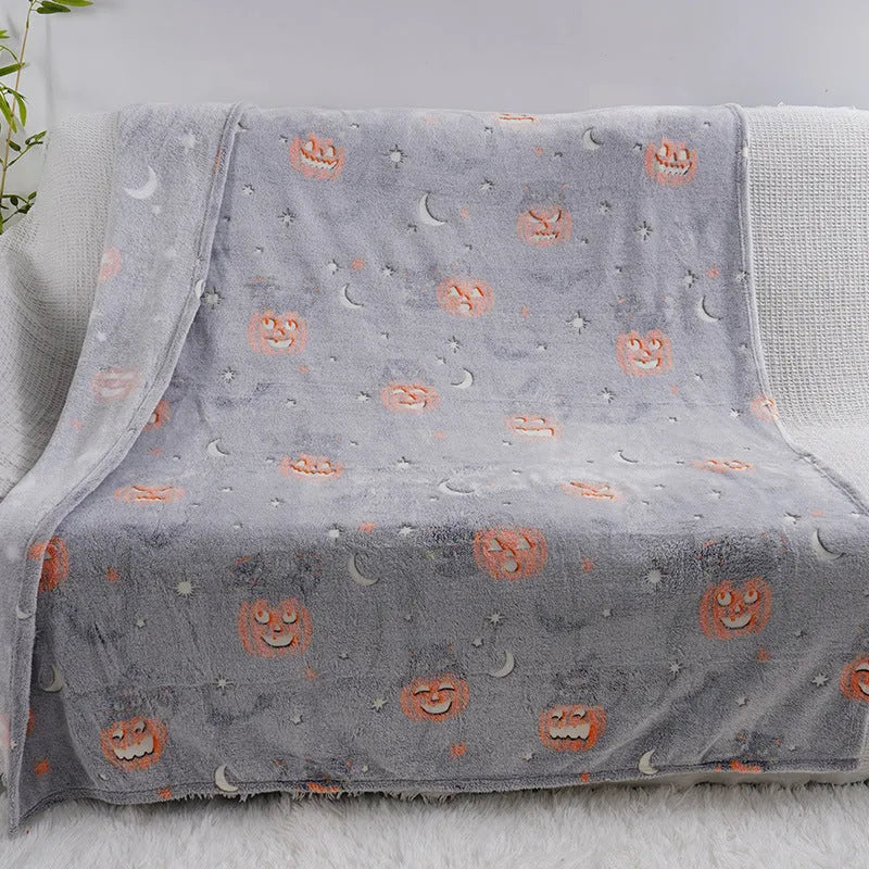 Cartoon patterned flannel blanket showing two size options for use as a child's blanket or air conditioner cover.