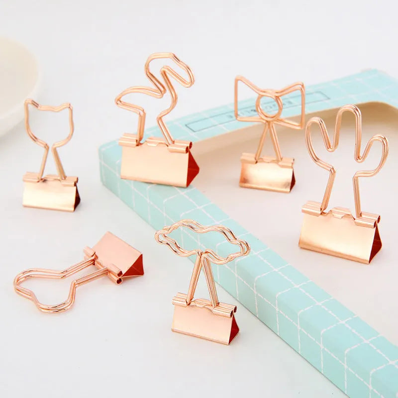 Gold metal office clip with long tail and decorative charm options including flamingo, love, clouds, cat, cactus and bow designs