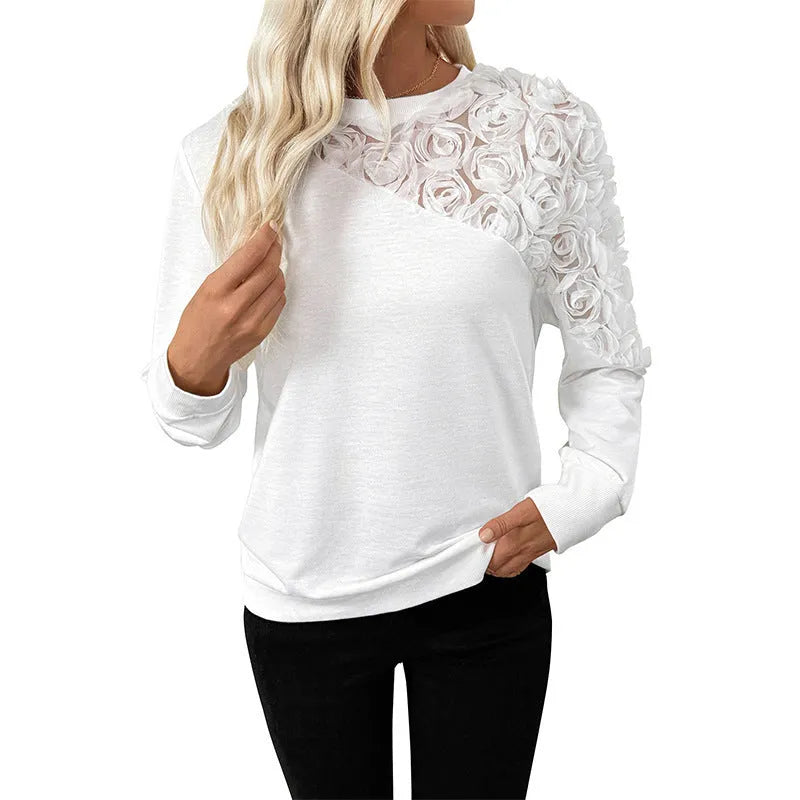 White floral pattern long sleeve pullover top with loose fit on hanger