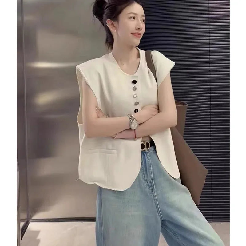 Women's milky white loose-fit polyester vest with pockets, shown with a short 40cm length.