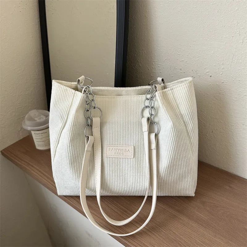 Corduroy one-shoulder tote handbag in horizontal square shape with three-dimensional pocket