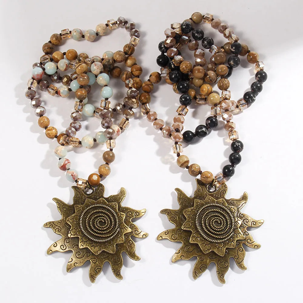 Natural stone beaded necklace with ancient cyan sun pendant and glass knotted chain in black or dark brown.