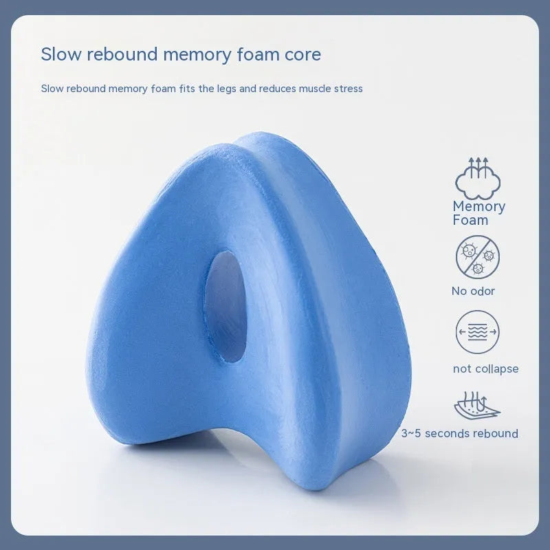 Heart-shaped dark blue jacquard memory foam leg pillow for adult knee and leg support.