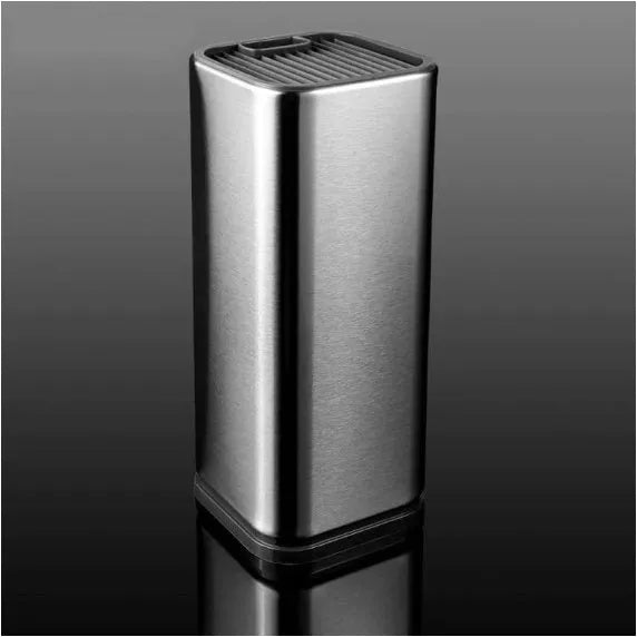 Black stainless steel kitchen tool holder with detachable base next to knives and cutlery