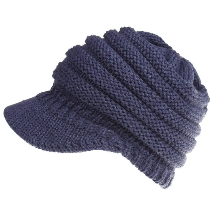 Women's knitted beanie with ponytail hole in acrylic yarn for winter wear