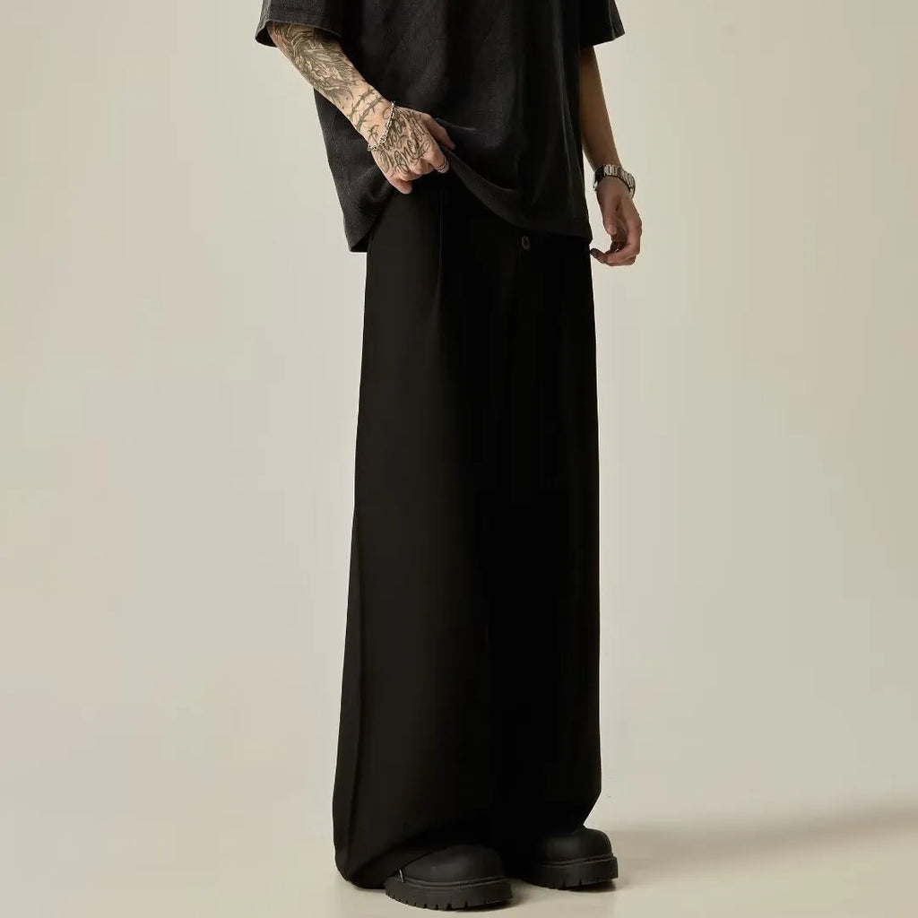 Men's black vertical tube wide-leg casual trousers showing straight-leg silhouette and mid waist design