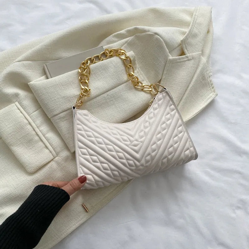 Brown pleated chain baguette shoulder bag showing vertical square shape and adjustable strap