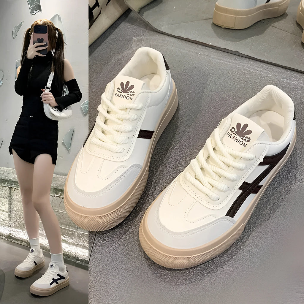 Blue and brown low-top lace-up board shoes with patent leather upper and flat rubber sole.