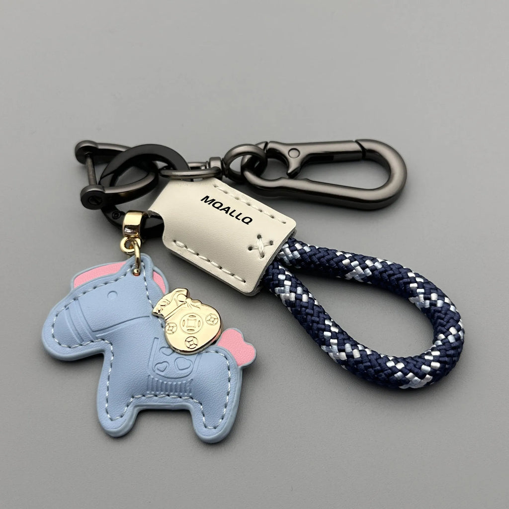 Handmade car keychain with a zinc alloy pony charm on a cowhide cord, shown in multiple colour options.