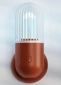 Portable capsule-shaped ultraviolet UVC disinfection lamp in black, showing compact size.