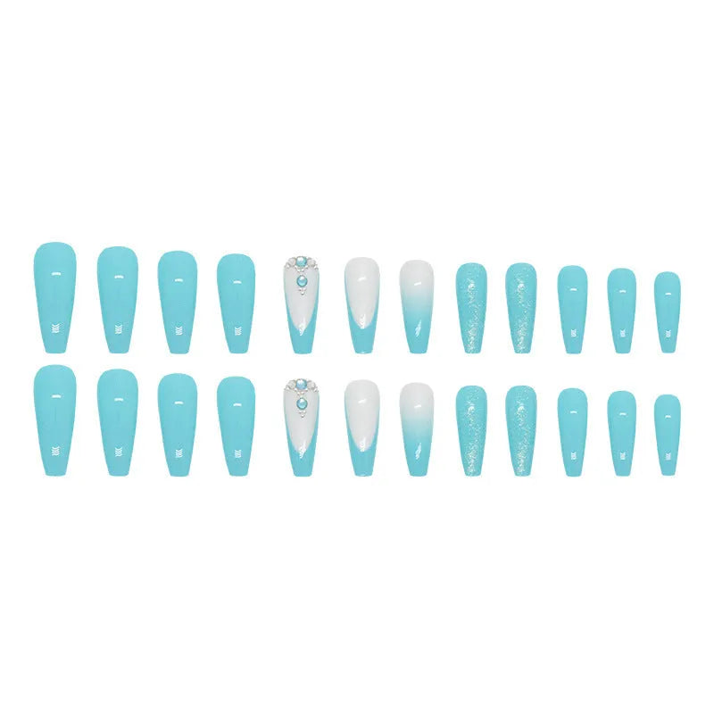 Long smart blue diamond false ballet nails with glitter particles and glue tube.