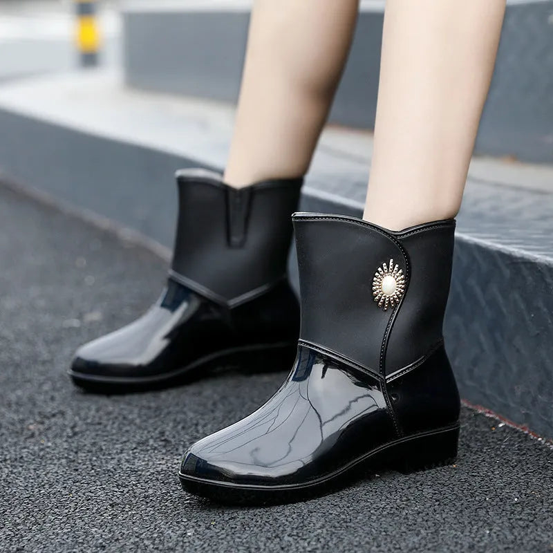 Women's purple PVC fashion rain boots with non-slip sole and low tube socks design