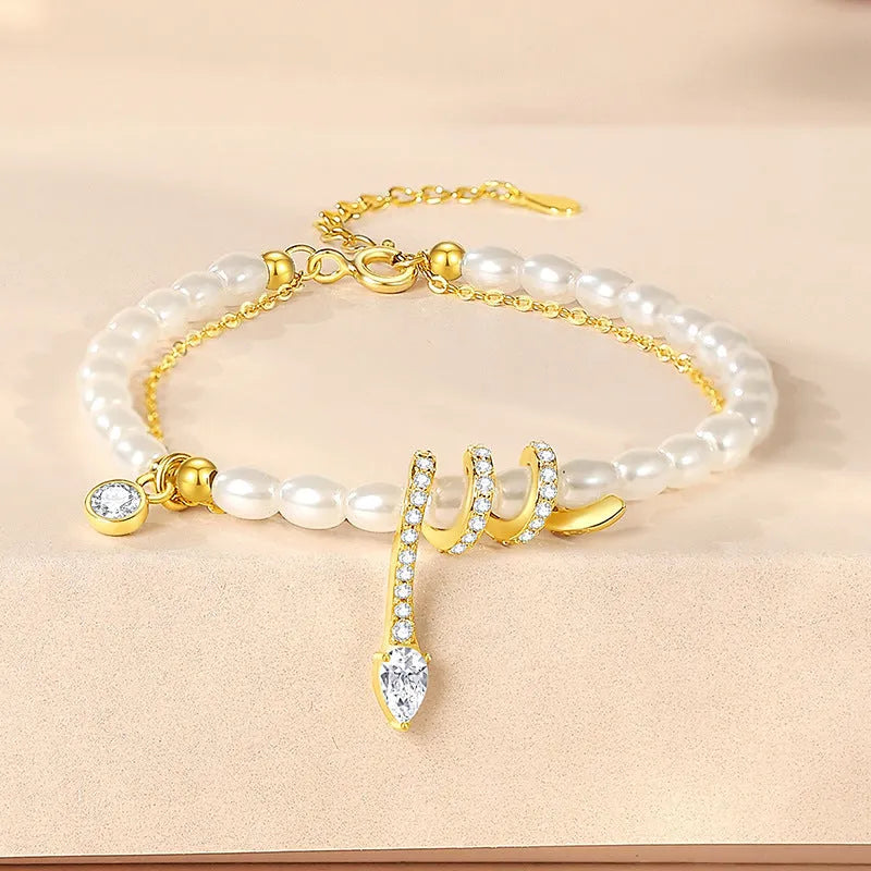 Pearl snake bracelet with geometric design in 925 silver with gold or white gold electroplating