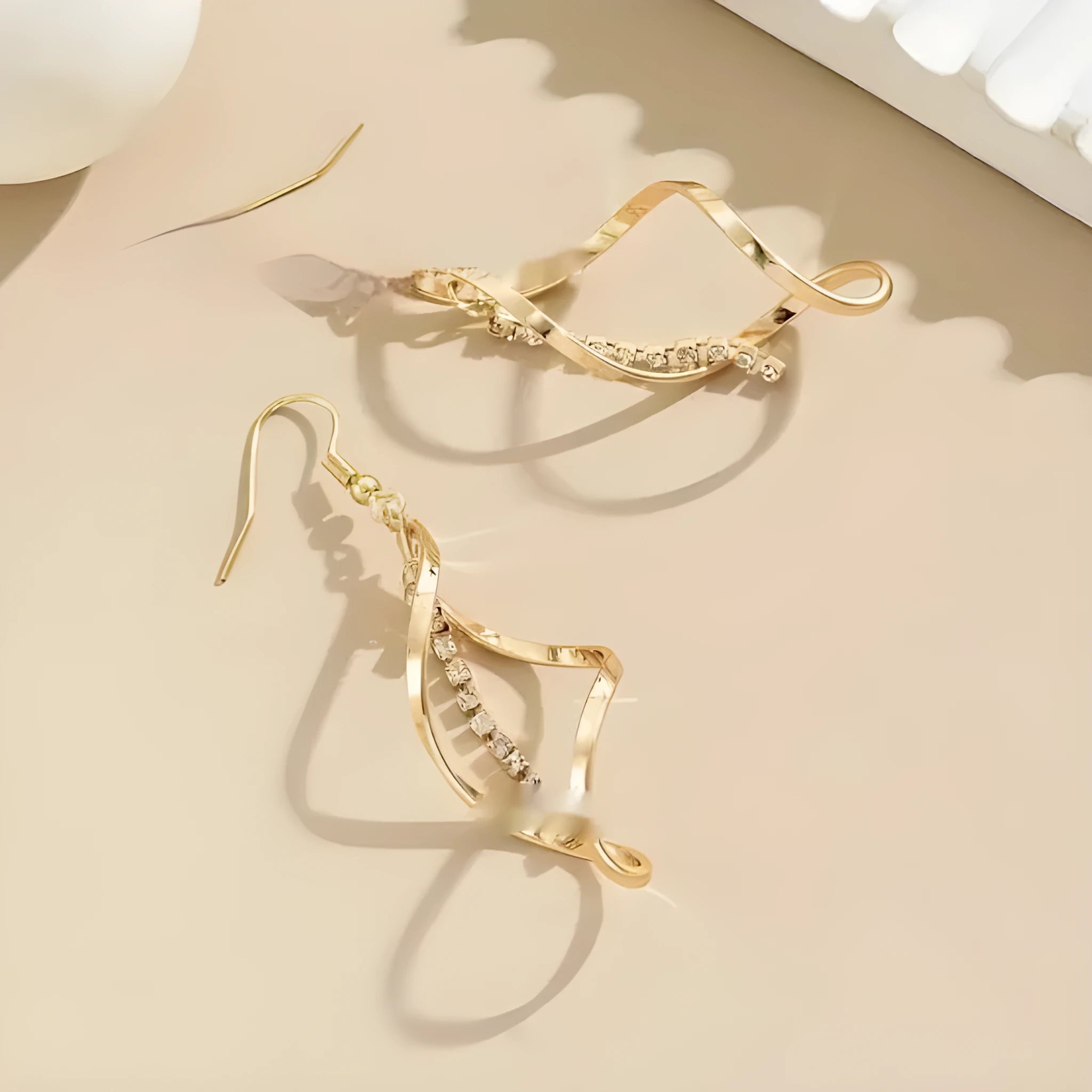 Gold geometric spiral drop earrings with oval detailing for women